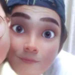 Cartoon-style boy with cap and big eyes, smiling at the camera